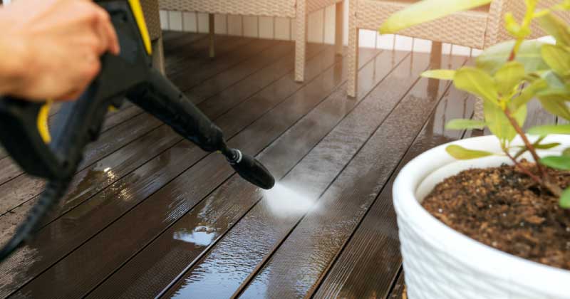 What issues should I be aware of when power washing a deck?