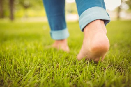 Walking barefoot on grass is beneficial
